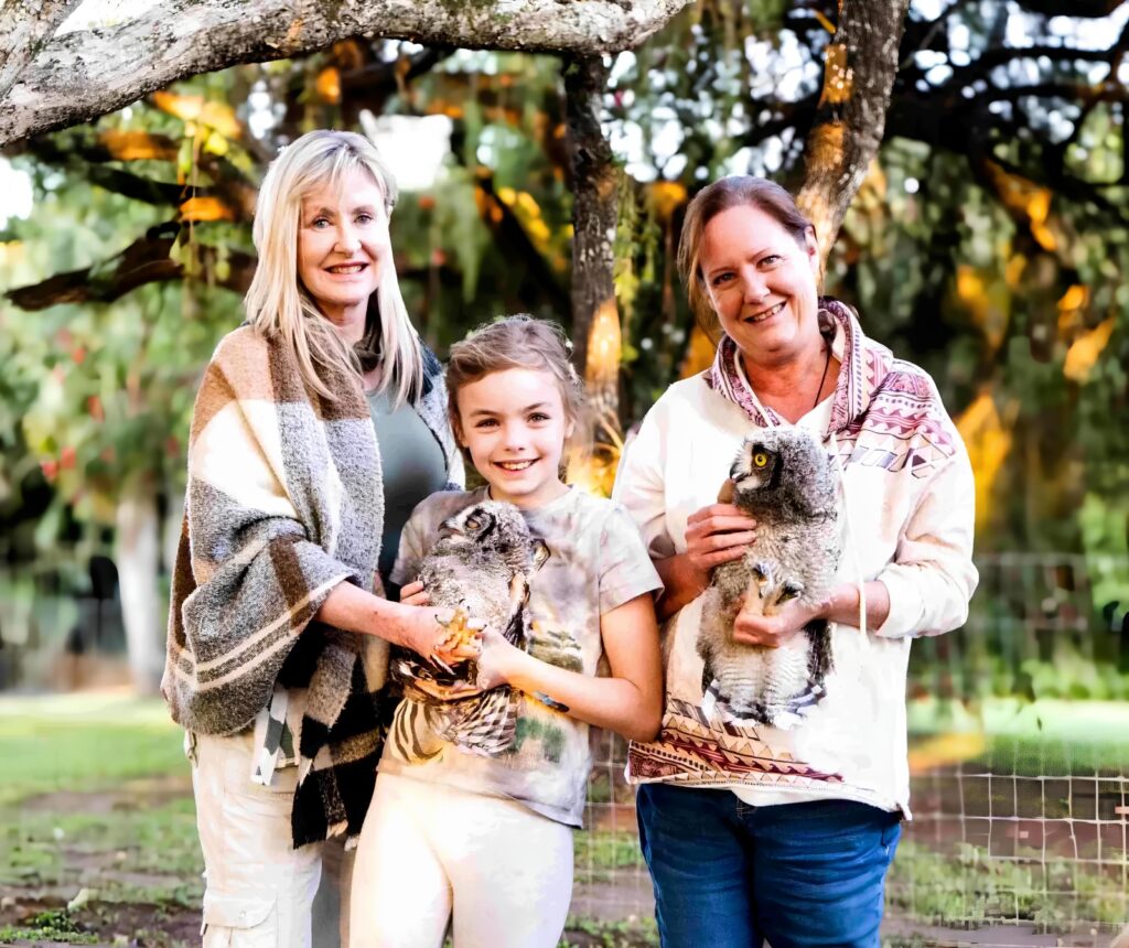 Lindy Elmes from Wildlife Rescue NPC surrounded by rescued South African wildlife.